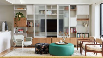 a modern apartment with built in tv storage