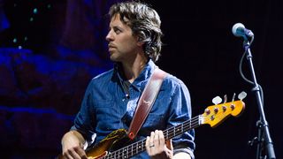 Bassist Sean Hurley of John Mayer's band performs at the DTE Energy Music Theater on August 7, 2013 in Clarkston, Michigan