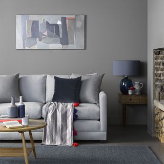 Modern grey living room ideas with tonal grey sofa and armchair