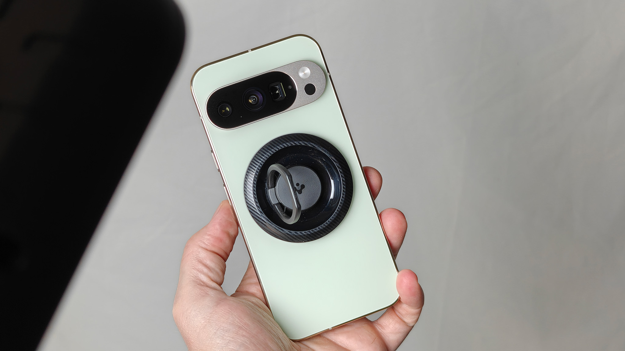 The jade Google Pixel 10 Pro with a Spigen MagSafe ring attached