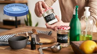 Natural cleaning supplies including baking soda and lemon 