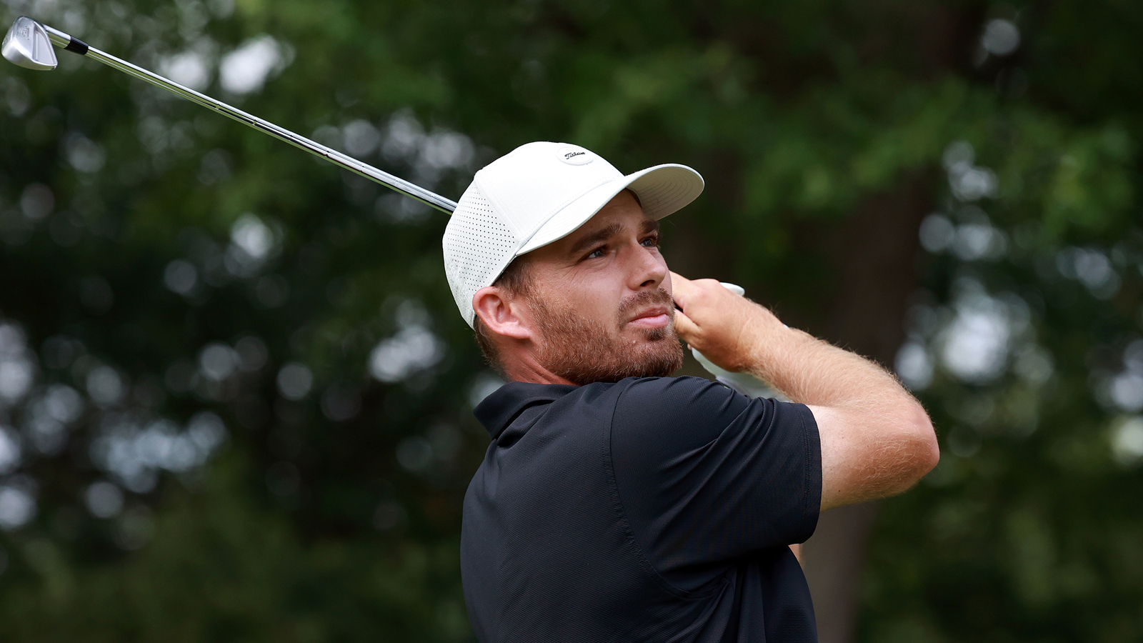 Aaron Wise hits an iron shot