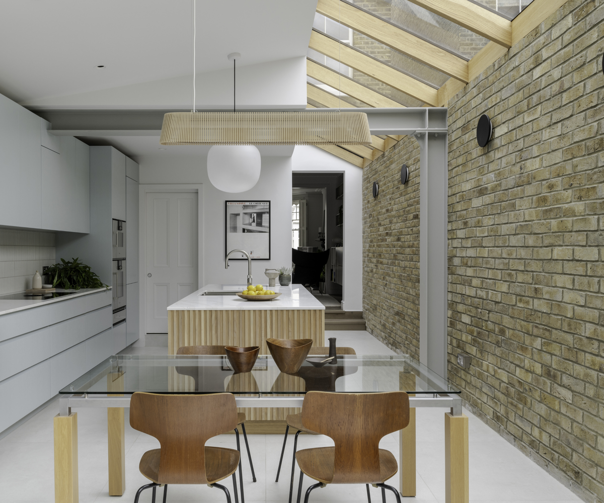 kitchen with roof lights and brick wall on right hand side