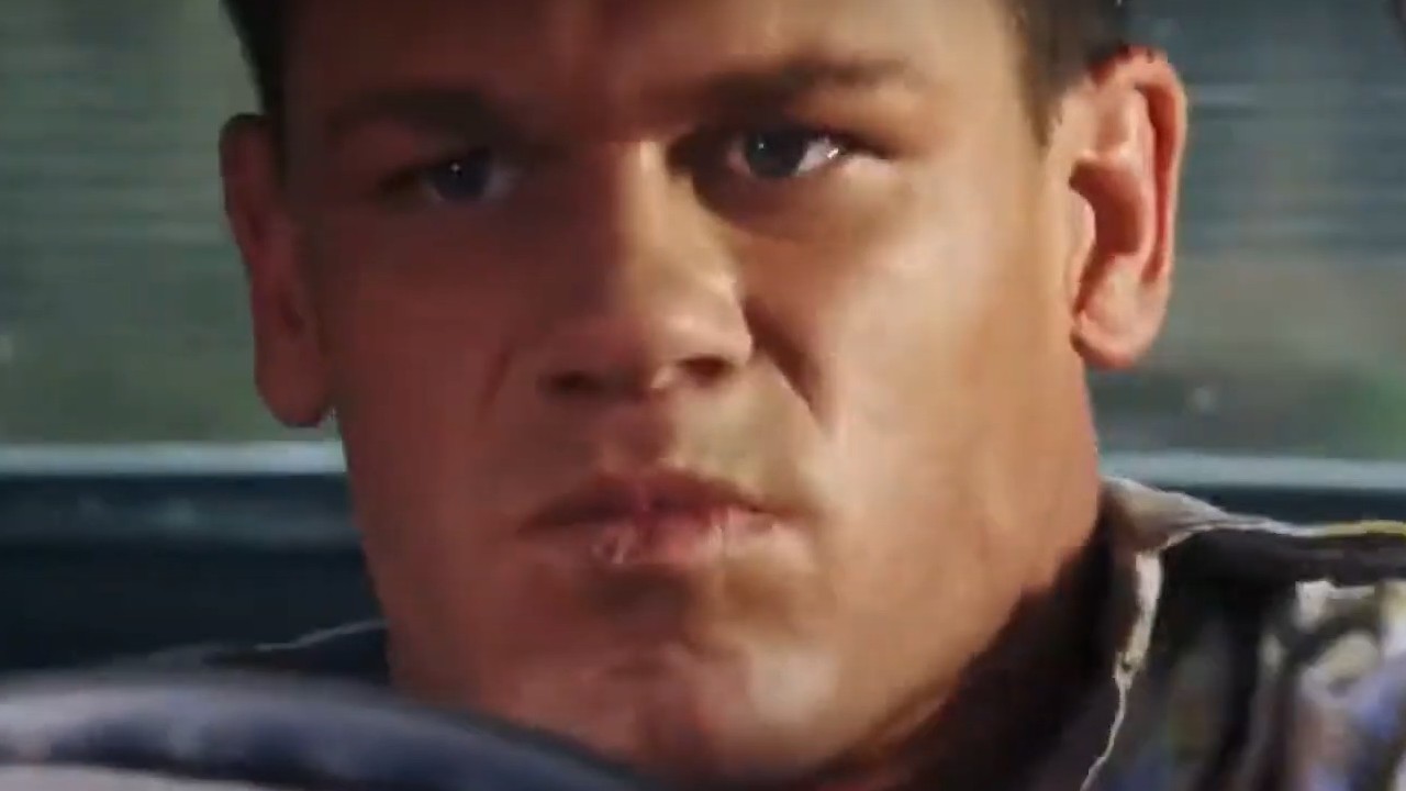 John Cena driving with intensity in The Marine