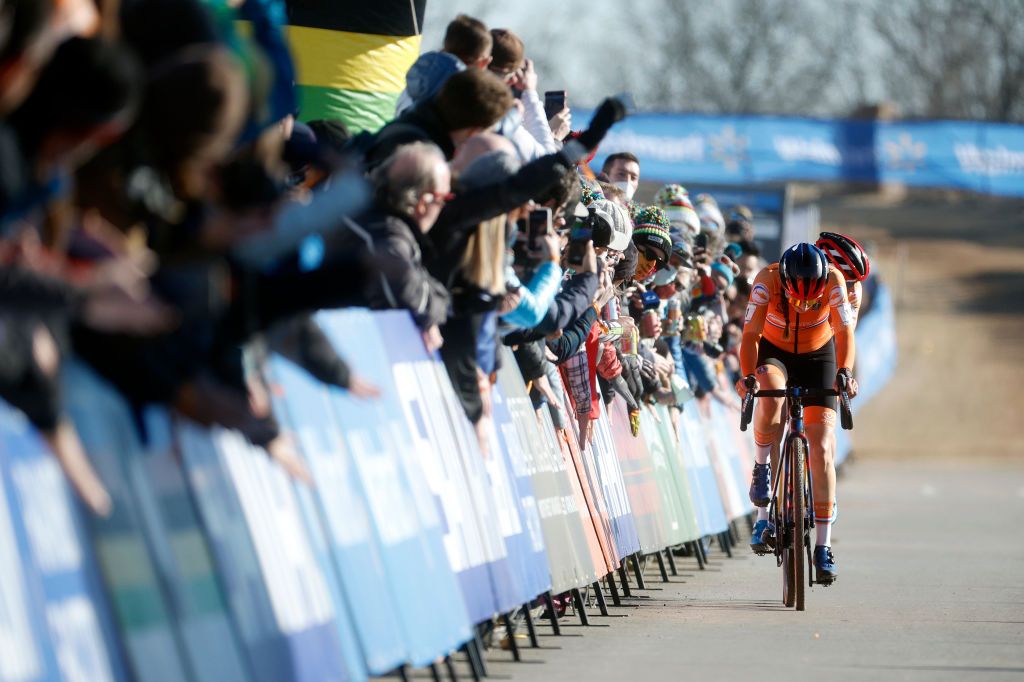 FAYETTEVILLE ARKANSAS JANUARY 29 LR Marianne Vos of Netherlands and Lucinda Brand of Netherlands compete while fans cheer during the 73rd UCI CycloCross World Championships Fayetteville 2022 Mens U23 Fayetteville2022 on January 29 2022 in Fayetteville Arkansas Photo by Chris GraythenGetty Images