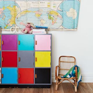 kids with wooden flooring and globe on wall