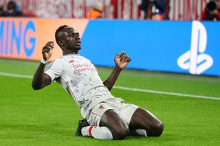 Sadio Mane of Liverpool celebrates as he scores his team's first goal during the UEFA Champions League Round of 16 Second Leg match between FC Bayern Muenchen and Liverpool at Allianz Arena on March 13, 2019 in Munich, Bavaria.