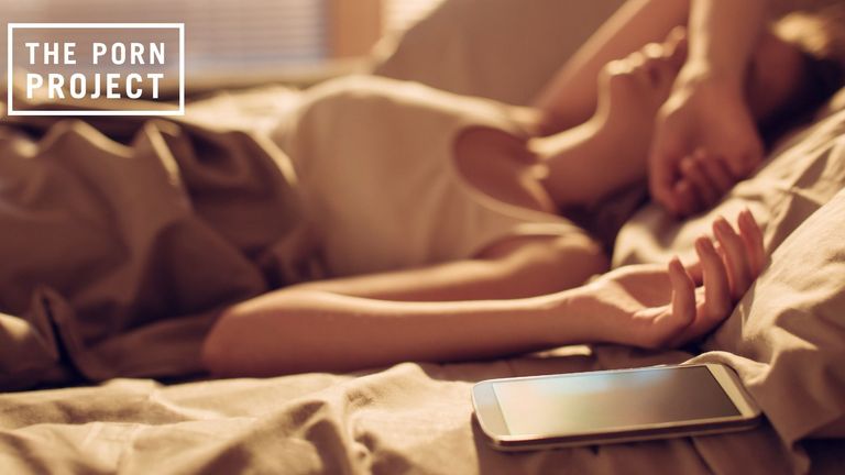 Woman Laying on Bed Next to Phone