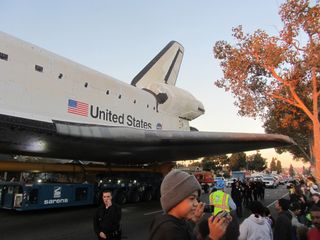 Shuttle Endeavour's Wing Glides Over Crowd