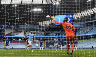 Manchester City striker Sergio Aguero sees his Panenka penalty saved by Chelsea's Edouard Mendy in May 2021.