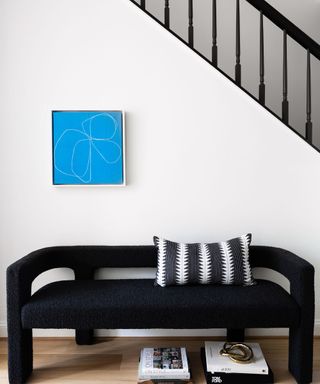 black bench and stairs with blue artwork