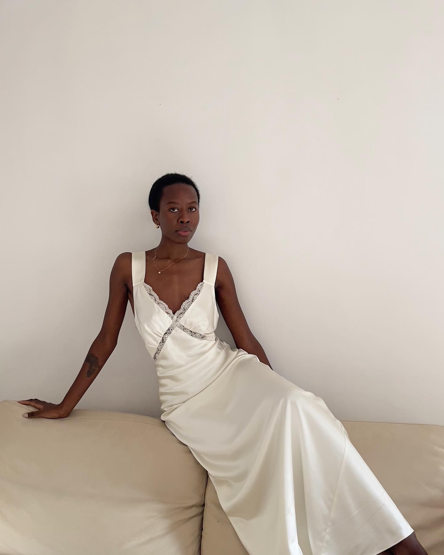 An image of @sylviemus_ wearing one of the key summer dress trends for 2025.