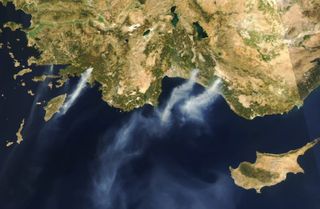 NASA's Aqua satellite captured a couple of the wildfires burning in Turkey's southwestern and southern coasts on Aug. 3.