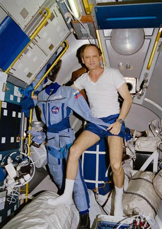 Astronaut Norman E. Thagard floats in the Space Shuttle Atlantis