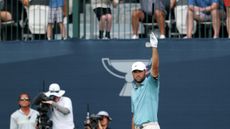 Scottie Scheffler celebrates chipping in on the 17th hole of the BMW Championship final round