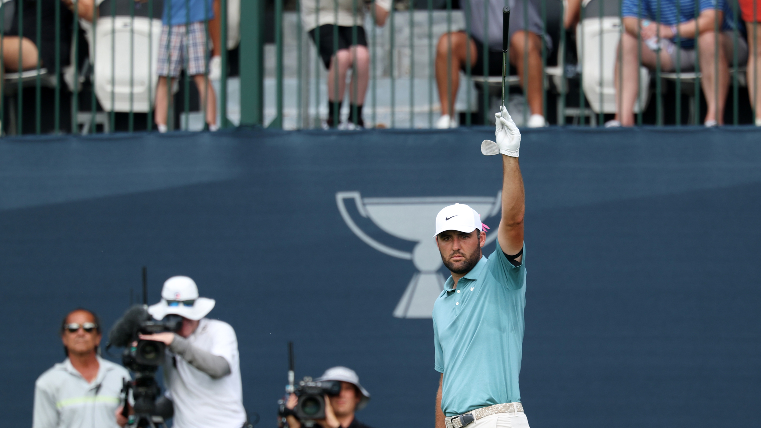 Scottie Scheffler celebrates chipping in on the 17th hole of the BMW Championship final round
