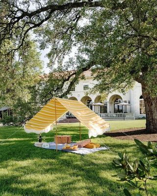 A backyard cabana in yellow