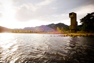 Seljord watch tower with water infront and mountains behind