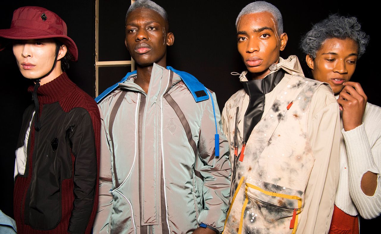 Four male models modelling various styles of clothing at the London Fashion week.