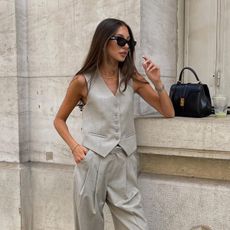 Woman wearing button down sleeveless spring vest