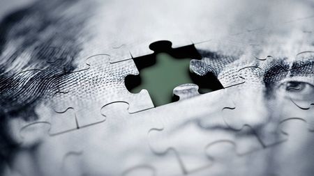 Macro shot of US dollar jigsaw puzzle