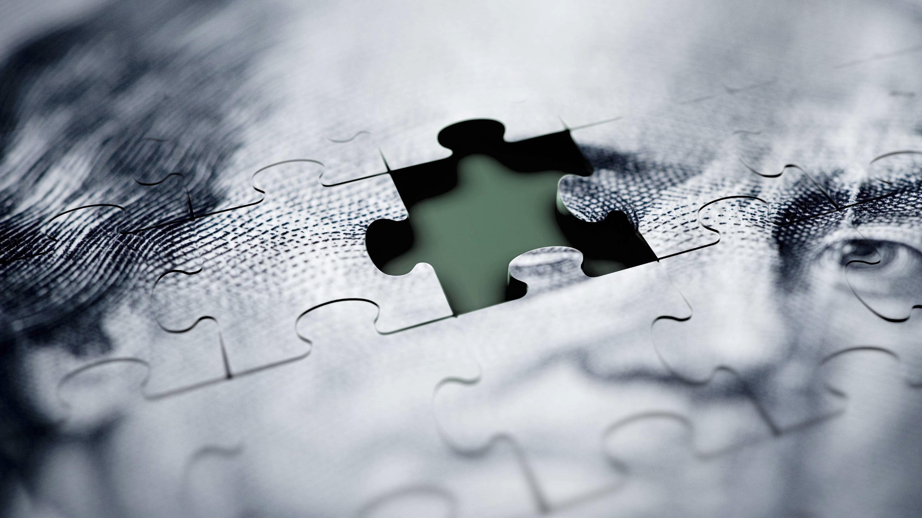 Macro shot of US dollar jigsaw puzzle