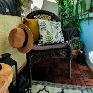balcony garden with click flooring and wooden chair