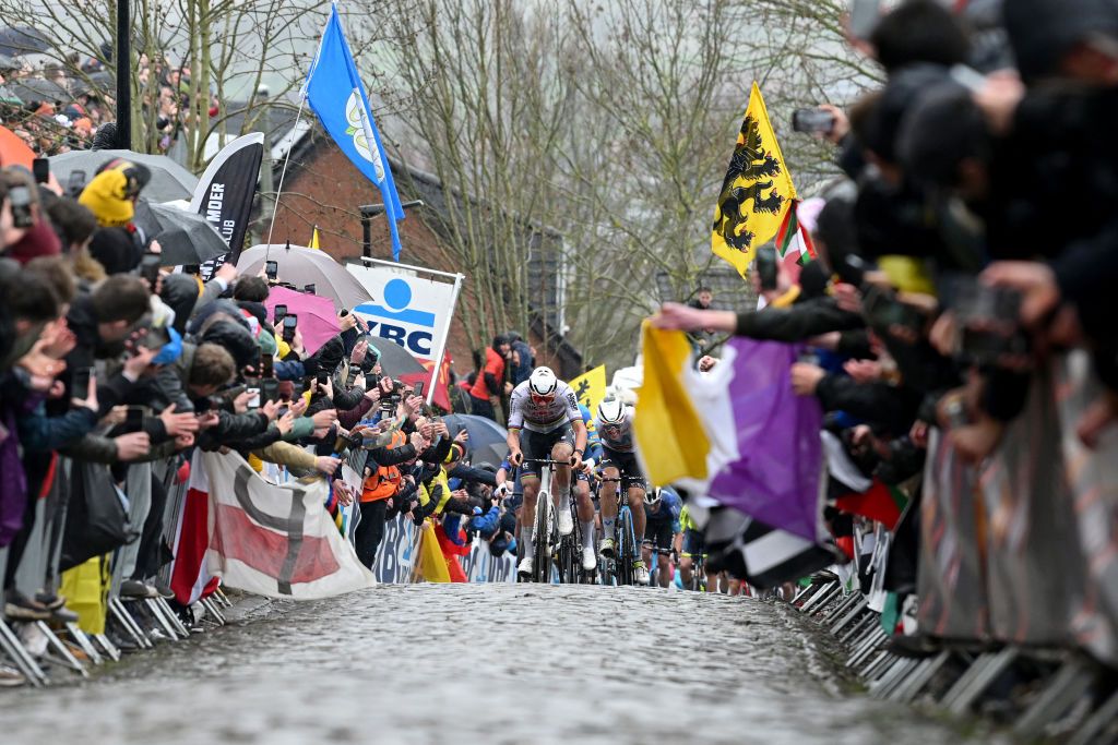 OUDENAARDE BELGIUM MARCH 31 Mathieu van der Poel of The Netherlands and Team Alpecin Deceuninck attacks passing through a cobblestones sector while fans cheer during the 108th Ronde van Vlaanderen Tour des Flandres 2024 Mens Elite a 2708km one day race from Antwerpen to Oudenaarde UCIWT on March 31 2024 in Oudenaarde Belgium Photo by Dario BelingheriGetty Images