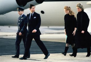 Prince Charles, Princess Diana and Sarah Ferguson, Duchess of York, return to England with the coffin of their friend Major Hugh Lindsay at RAF Northolt on March 12, 1988
