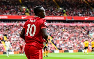 Liverpool forward Sadio Mane prepares to take a throw-in