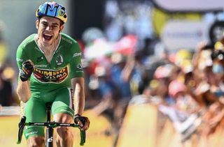 TOPSHOT JumboVisma teams Belgian rider Wout Van Aert wearing the sprinters green jersey celebrates as he cycles to the finish line the 18th stage of the 109th edition of the Tour de France cycling race 1432 km between Lourdes and Hautacam in the Pyrenees mountains in southwestern France on July 21 2022 Photo by Marco BERTORELLO AFP Photo by MARCO BERTORELLOAFP via Getty Images