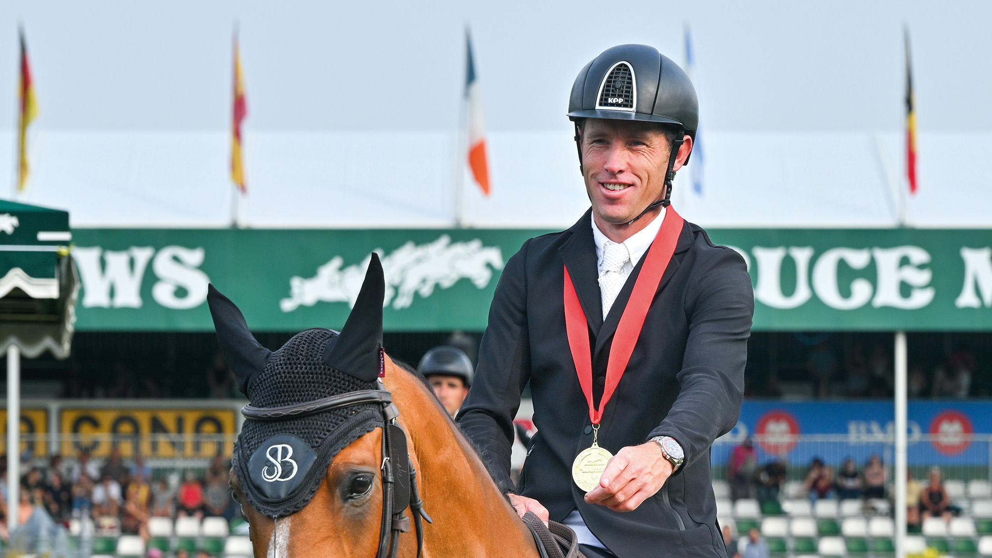 Scott Brash in front of the grandstand at Spruce Meadows after winning the grand prix on Hello Jefferson.