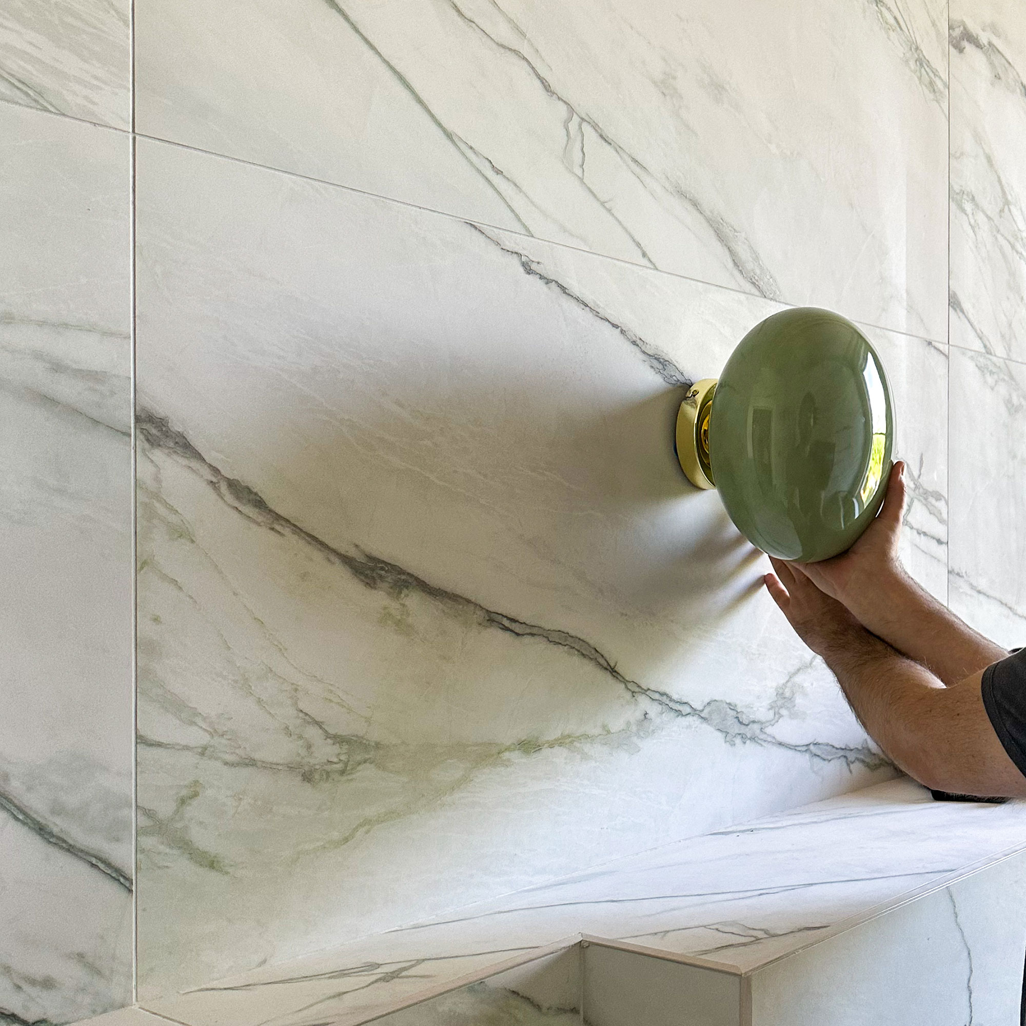 Tiles wall with green wall light