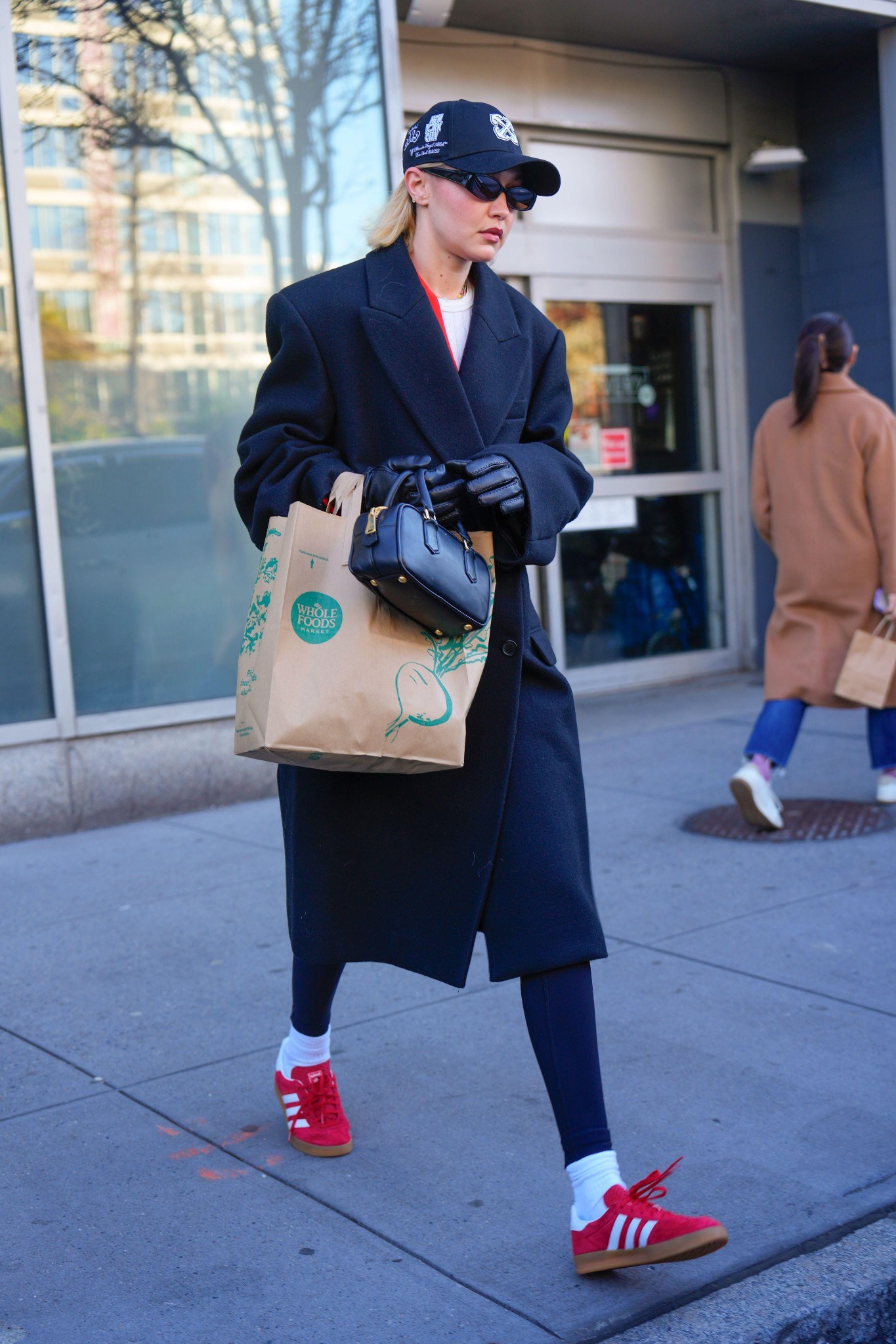 Gigi Hadid in red Adidas shoes