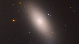 A galaxy with an exceptionally bright, stretched-out disk of light around it