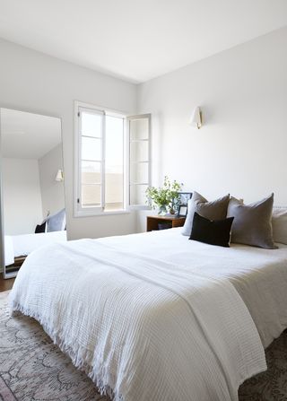 a minimalist white bedroom
