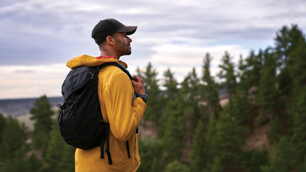 Man hiking while wearing the Garmin epix (Gen 2)