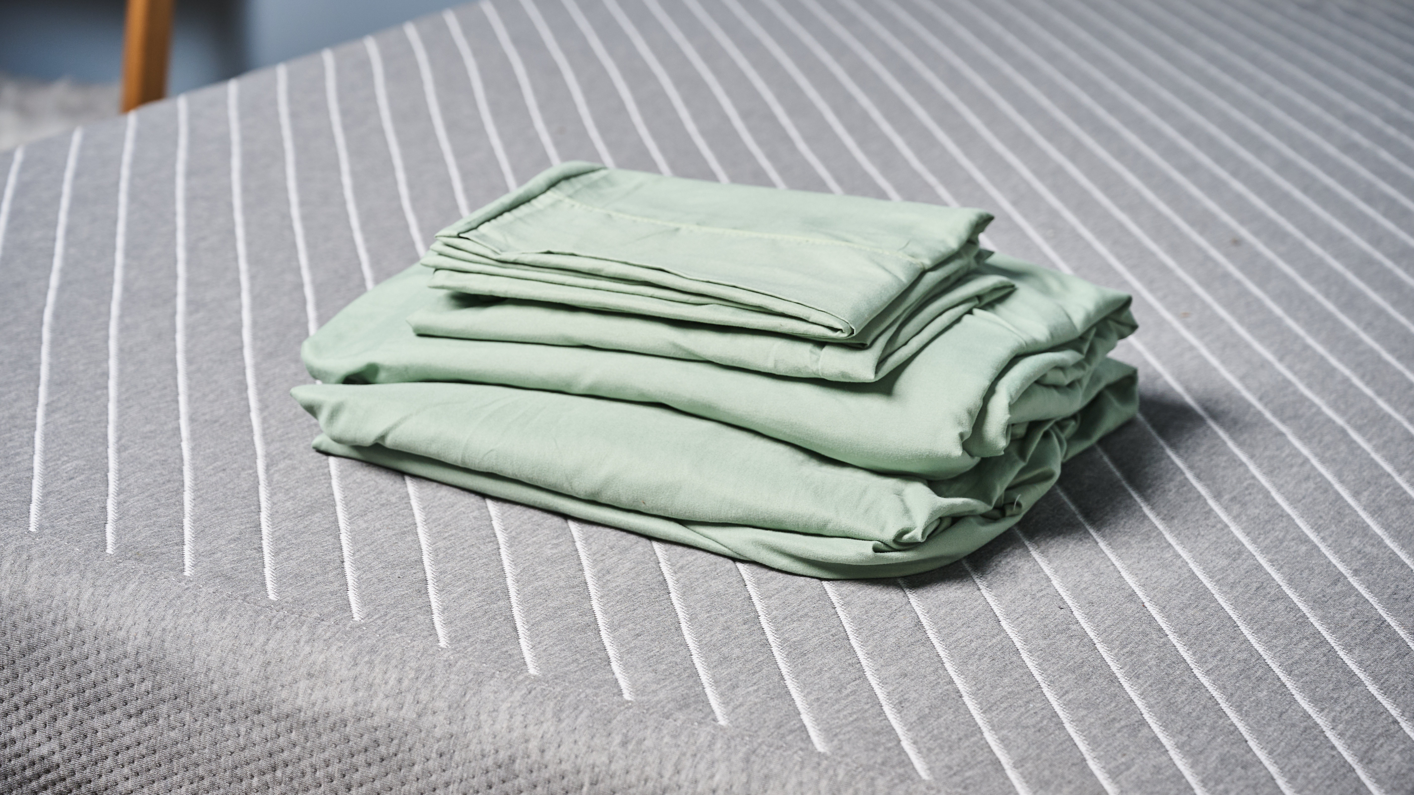 Utopia Bedding Sheet set folded and placed on the bed in our sleep studio