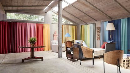 open plan living space with multicolored curtains 