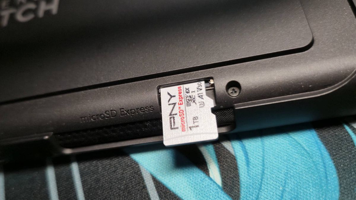 Image of the 1TB PNY microSD Express card sticking out of the Switch 2 card slot.