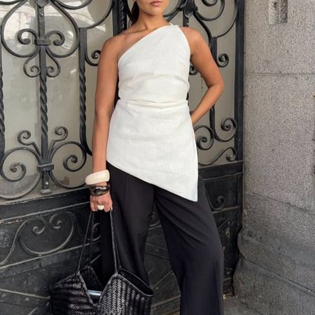 Woman in a chic summer top and black pants