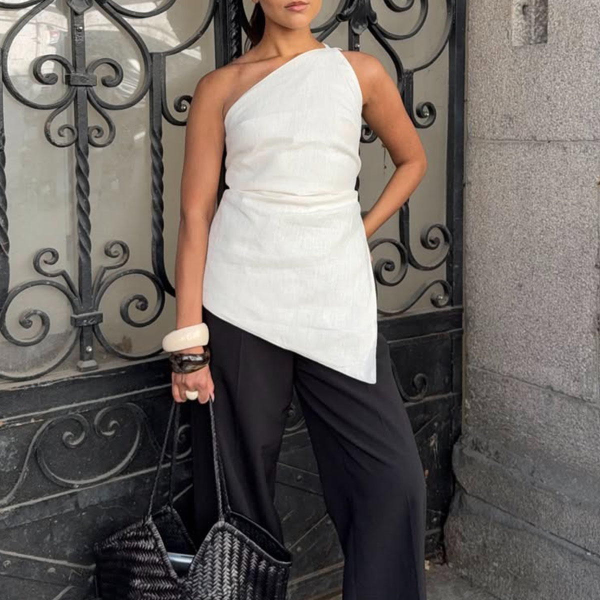 Woman in a chic summer top and black pants