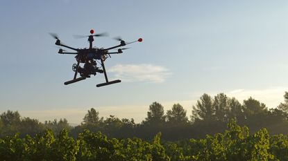 Drone flying over field