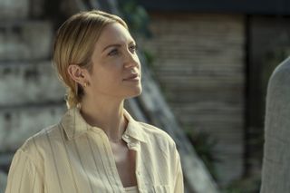 brittany snow as alice wearing a striped white shirt in a still from the night agent