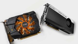 Two Nvidia GeForce GTX 600 series cards side by side on grey