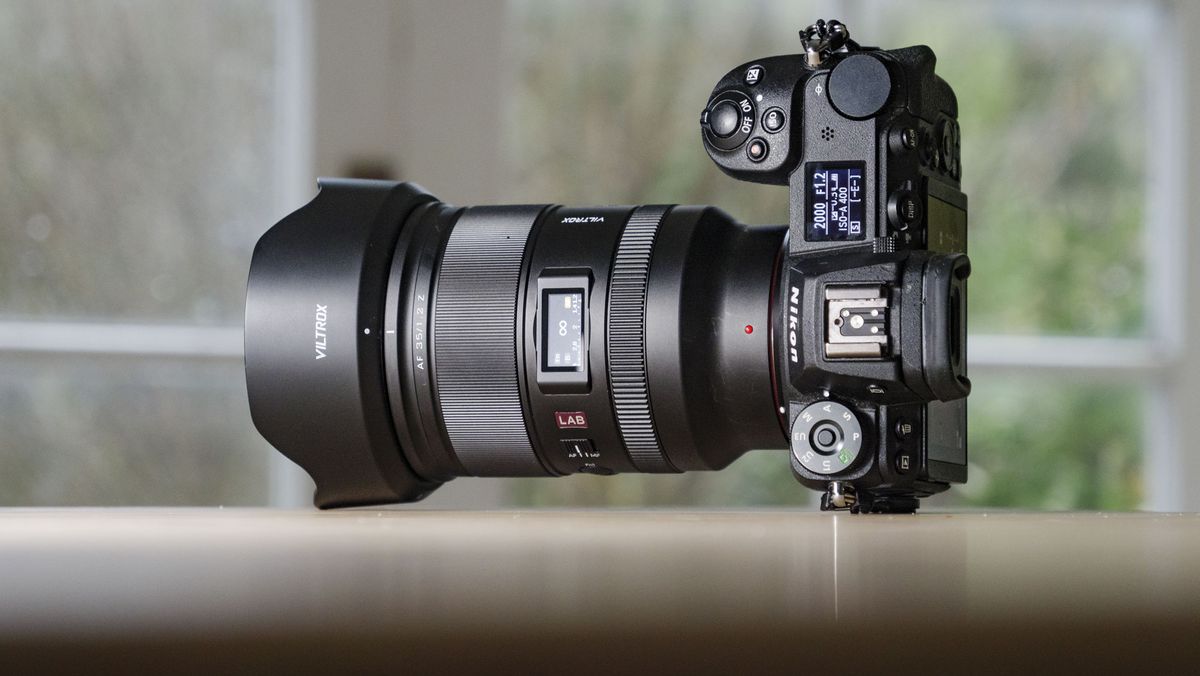 Viltrox AF 35mm F1.2 LAB Z lens for Nikon, attached to a Nikon Z6 II, on a wooden table