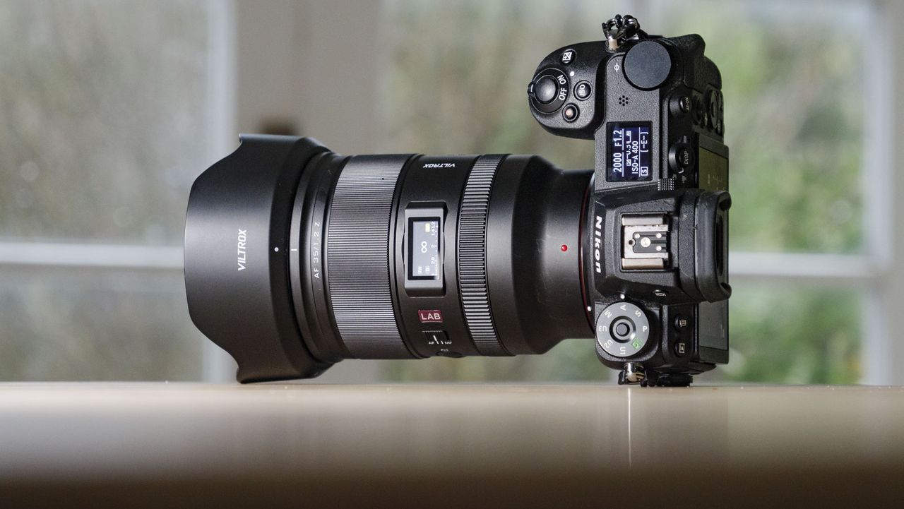 Viltrox AF 35mm F1.2 LAB Z lens for Nikon, attached to a Nikon Z6 II, on a wooden table