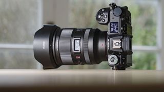 Viltrox AF 35mm F1.2 LAB Z lens for Nikon, attached to a Nikon Z6 II, on a wooden table