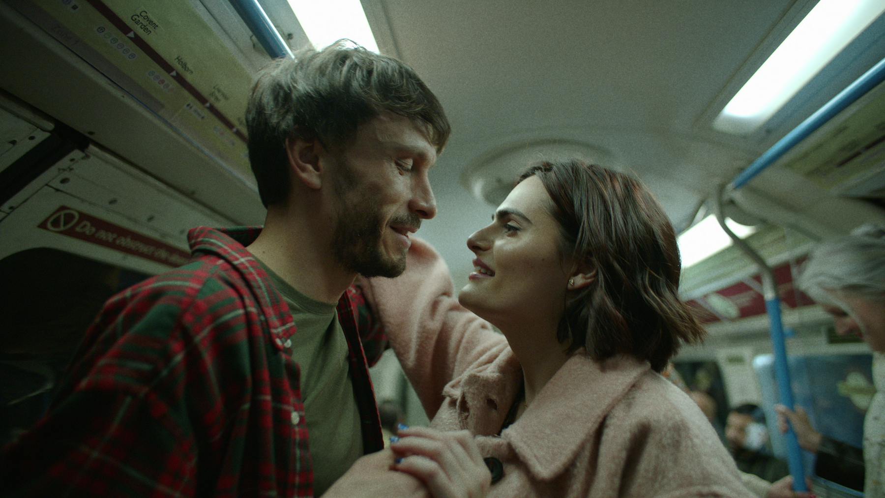 richard gadd as donny dunn and nava mau as teri, standing in a subway car, in 'Baby Reindeer'