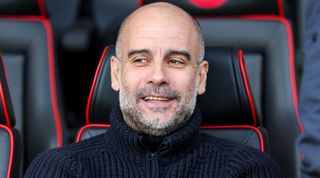 Manchester City manager Pep Guardiola looks on from the bench during the Premier League match between AFC Bournemouth and Manchester City at the Vitality Stadium on 25 February, 2023 in Bournemouth, United Kingdom.